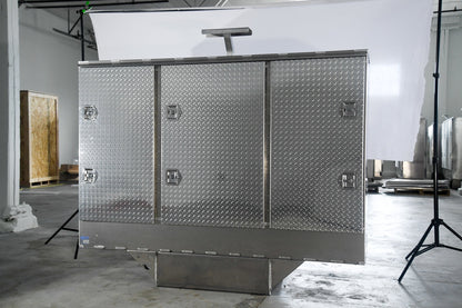 Metallic storage unit with diamond plate pattern in a studio setting